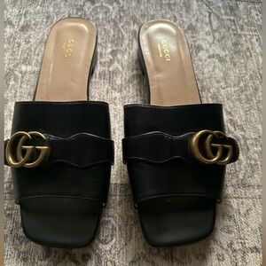 Gucci Black Mules with Gold Accents